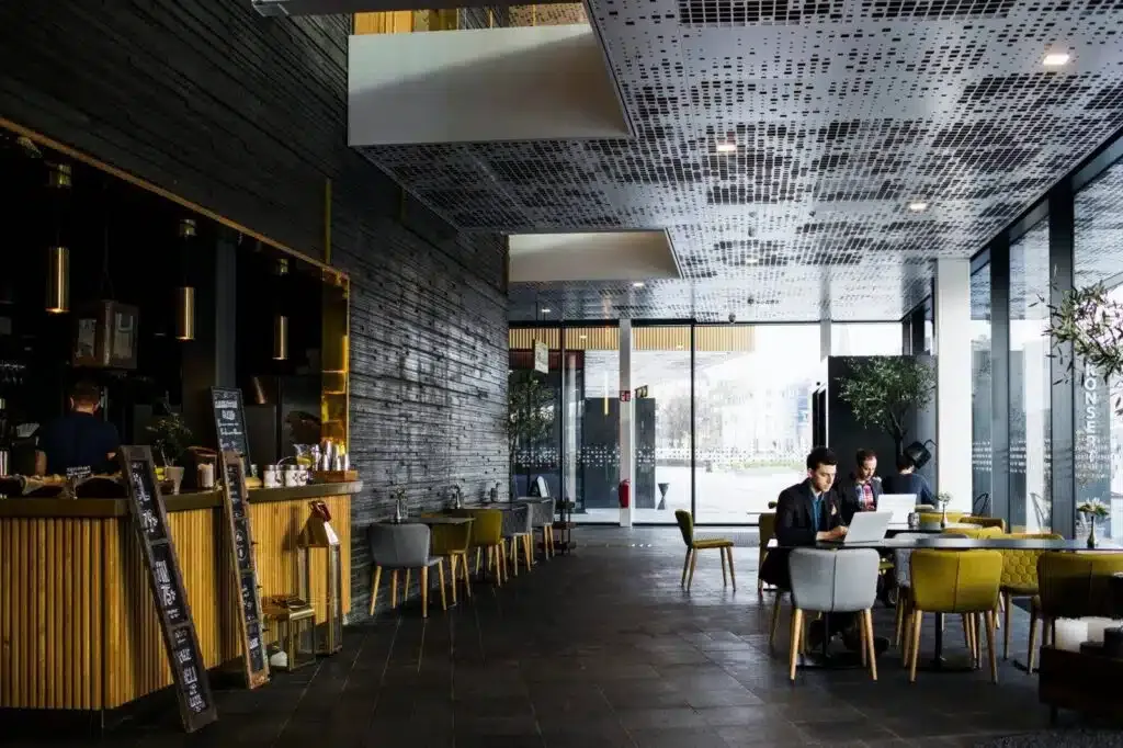Businessmen sitting at tables in restaurant